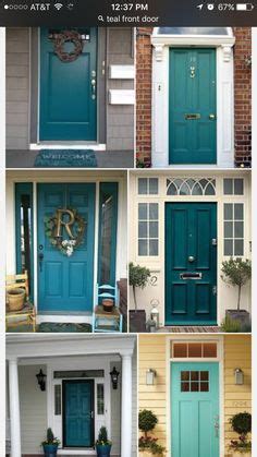 A deep turquoise entryway featured in hgtv magazine. teal front door. use gray shutters on the brick house too ...