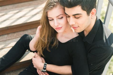Beautiful Young Multiracial Couple Student Couple In Love Sit Wooden