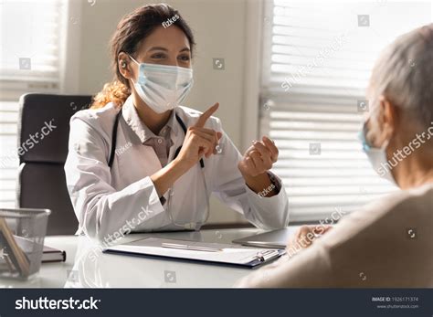 Close Smiling Female Doctor Wearing Medical Stock Photo 1926171374