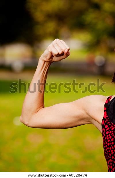 Female Flexing Her Bicep Muscle Stock Photo 40328494 Shutterstock