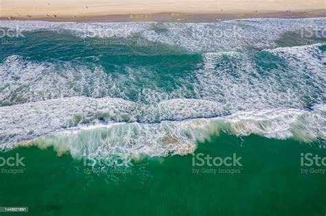 Aerial View Of Pacific Ocean Waves Breaking On The Sandy Gold Coast