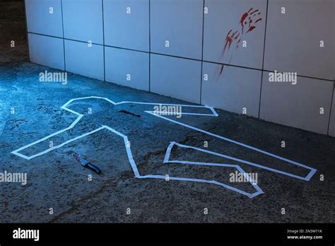 Crime Scene With Chalk Outline Knife And Blood Marks On Floor