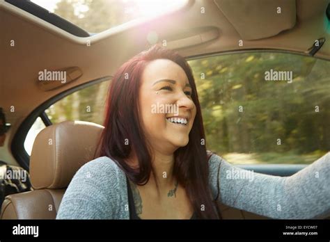 Smiling Young Woman Driving Car Stock Photo Alamy