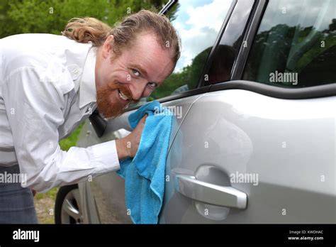 Portrait Of Funny Man Washing Car With A Cloth Stock Photo Alamy