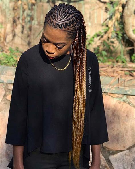 Cornrow bun at the centre and cornrow braids in the sides 43 Most Beautiful Cornrow Braids That Turn Heads | StayGlam