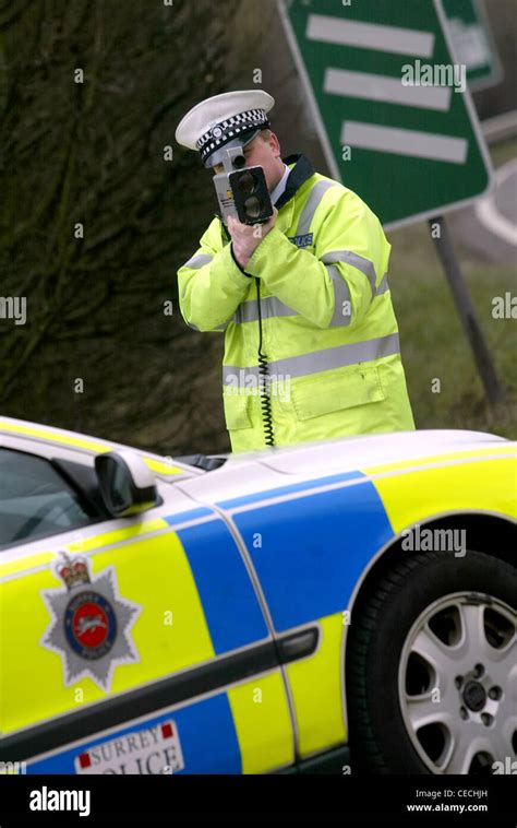 Traffic Police Officer Using Speed Trap Laser Gun United Kingdom Stock