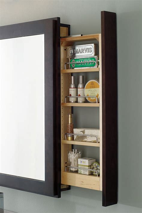 The material of the shelves is matched with the drawer cabinet. Bath Mirror with Pullout - Decora Cabinetry