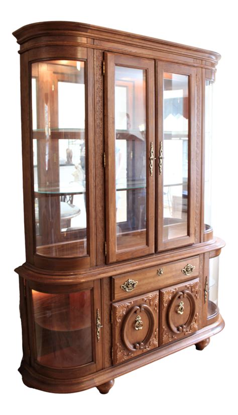 Carved Oak China Cabinet With Curved Glass Lights On Top And Bottom
