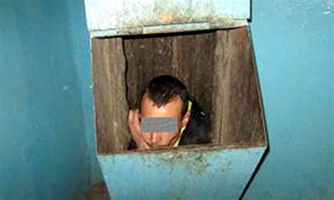 Russian Man Gets Caught In Trash Chute While Trying To Escape Blazing
