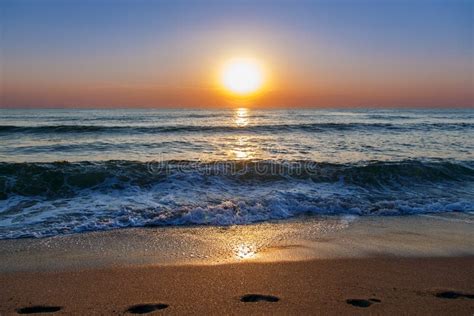 Beach Sand Sea Sky Sun Sunset Stock Photo Image Of Lake Orange 65710998