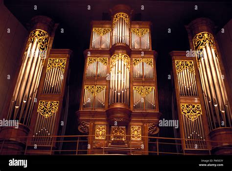 Pipe Organ With Gold Latticework In The Concert Hall Of Tokyo