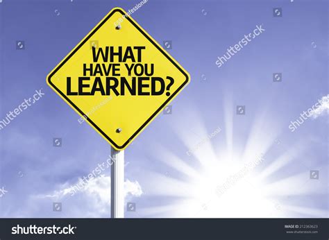 What Have You Learned Road Sign With Sun Background Stock