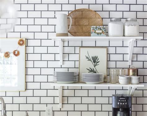 Kitchen carts and islands are your best kitchen friends. open kitchen shelving with white subway tile and charcoal ...