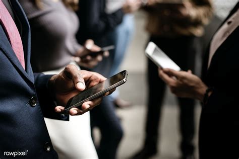 Business People Casually Using Smartphones Outdoors Premium Image By Jira