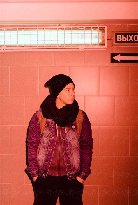Young Androgyne Woman On The Night Street Red Flash Light By Stocksy Contributor Alexey