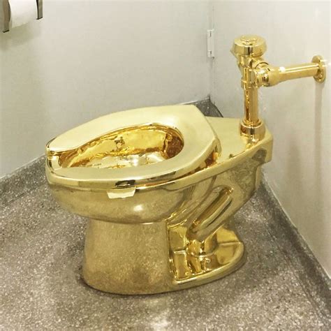 A woman posed for a photo next to a metal replica of former president donald j. Imagining Trump Sitting on Maurizio Cattelan's Gold Toilet