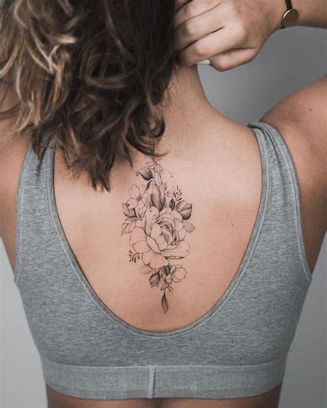 tattoo tattoo inspiration flower tattoo back tattoo spine tattoo dainty tat in 2020