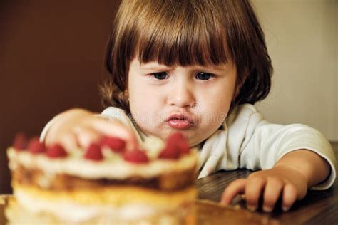 Cute Happy Baby Girl Eating Cake With Raspberries Adorable Little Girl