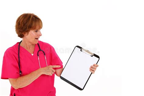 Nurse Pointing To Clipboard Stock Photo Image Of Front Aged 15821098