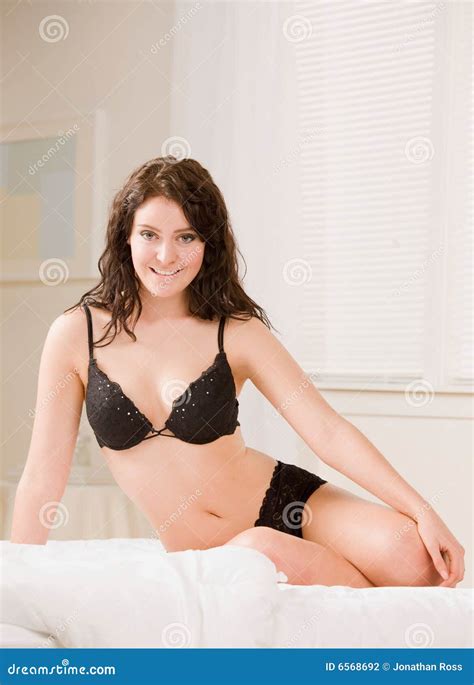 Woman In Bra And Underwear Posing On Bed Stock Photography Image