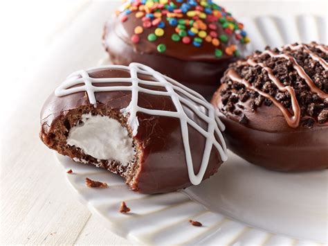 Get your favorite glazed doughnuts in a mini size with big taste. Krispy Kreme's New All-Chocolate Donut Collection Will ...