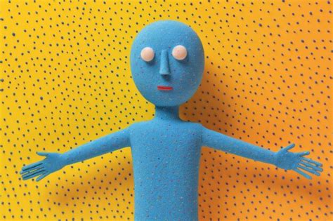 Premium Ai Image Blue Cartoon Character On A Yellow Background