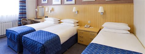 Modern And Well Equipped Triple Rooms At The Merton Hotel Merton