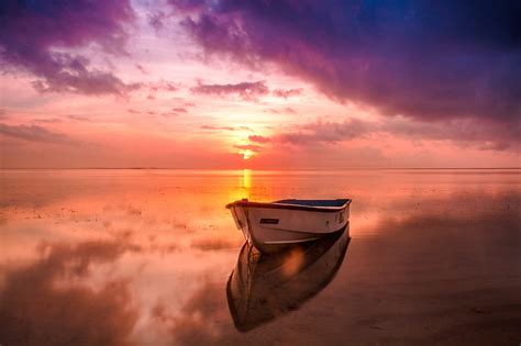 Royalty Free Photo White And Brown Wooden Boat On Sea Under Gray