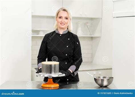 A Female Pastry Chef Prepares A Cake And Herself In The Kitchen Stock Image Image Of Female