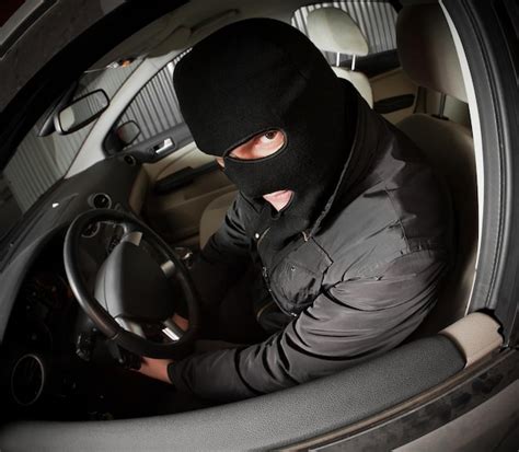 Premium Photo Robber And The Thief In A Mask Hijacks The Car