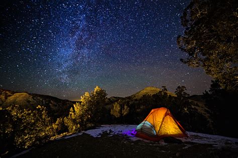 Camping In A Tent Under The Stars And Milky Way Galaxy Stock Photo