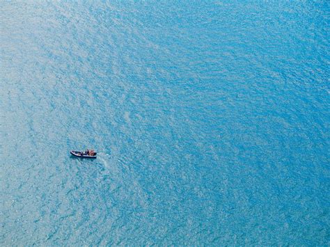 Ocean Birds Eye View Photography Of Boat On Body Of Water Sea Image