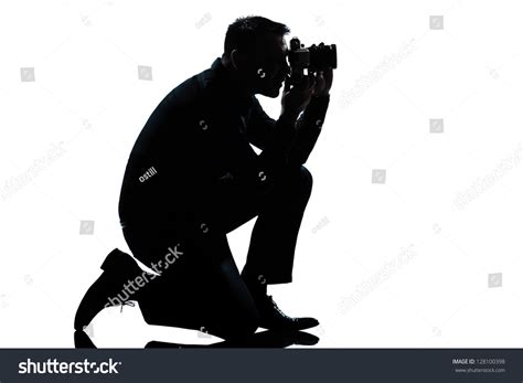 One Caucasian Man Kneeling Photographer Full Length Silhouette In