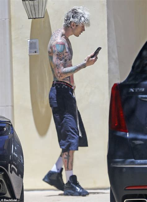 Machine Gun Kelly Goes Shirtless As He Takes A Call Following Steamy Music Video With Megan