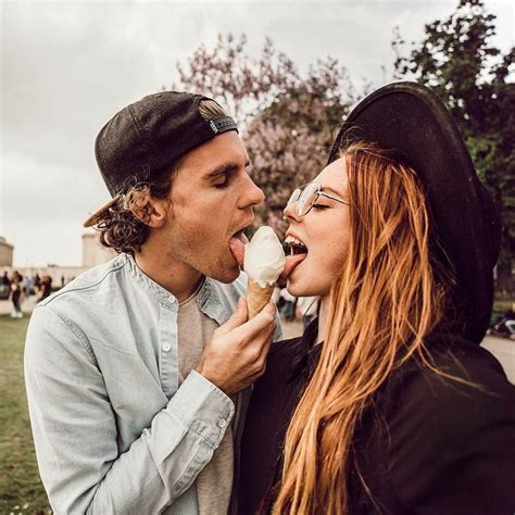 Two People Eating Ice Cream Outside On A Cloudy Day