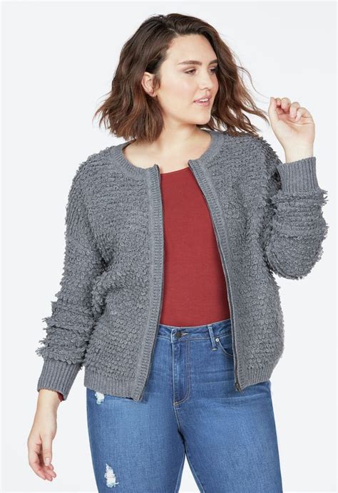 A Fuzzy Knit Cardigan Featuring A Zip Front Closure And Ribbed Cuffs