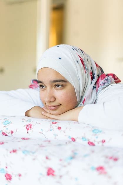 premium photo beautiful arabic girl on bed in modern bedroom