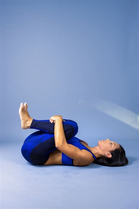 female yoga instructor does floor exercises in gym clothes stock image image of adult