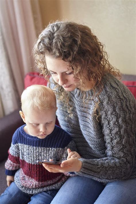 Mom Shows Her Little Son How To Use A Mobile Phone Stock Image Image