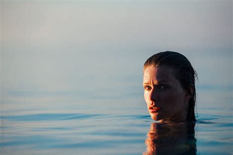 Portrait Of A Beautiful Woman Emerges From The Sea By Stocksy Contributor Alexandra Bergam