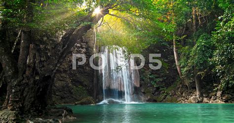 Majestic Waterfall And Beautiful Tropical Nature With Sun Light In