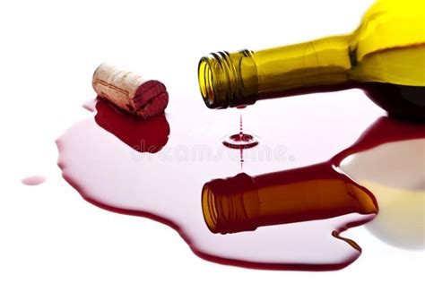 A Bottle Of Wine Is Spilled On The Floor With Red Liquid Spilling Out