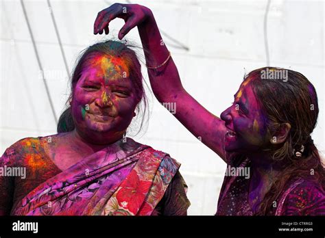 Women Covered In Colourful Dye Celebrating The Holi Festival Festival