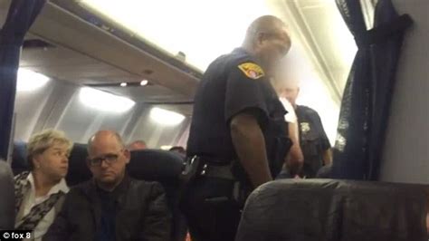 female passenger escorted off united airlines plane in handcuffs in cleveland daily mail online