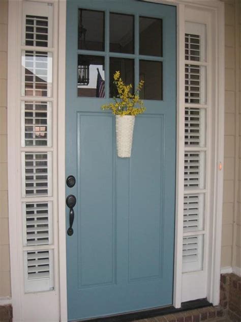 By paying attention to design, windows can become the focal point of a kitchen. Magnolia Bend Drive: A blue door and a kitchen window box