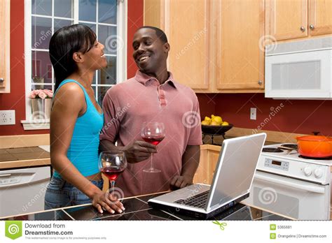 African American Couple Using Laptop In Kitchen Stock Image Image Of Attractive Computer 5365681