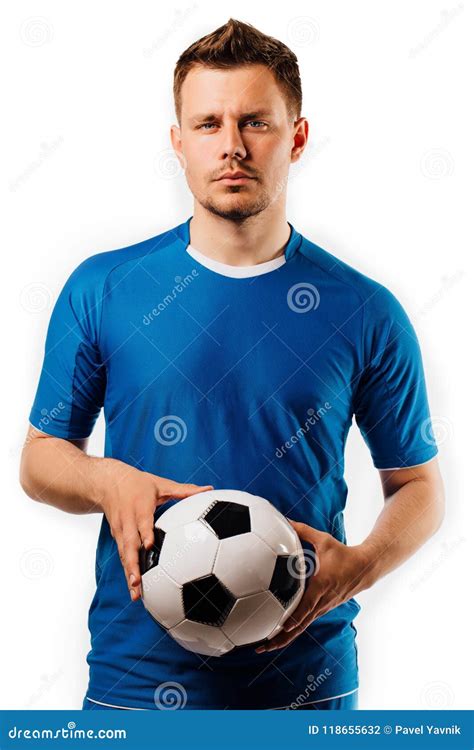 Young Handsome Football Player Holds In Hands Soccer Ball Posing On