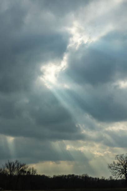 Best Sun Breaking Through Clouds Stock Photos Pictures And Royalty Free