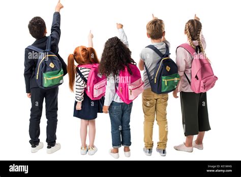 Back View Of Multiethnic Children With Backpacks Pointing At Copy Space