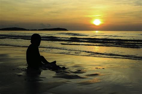 Lonely Boy Playing Alone On The Beach Stock Image Image Of Sunrise
